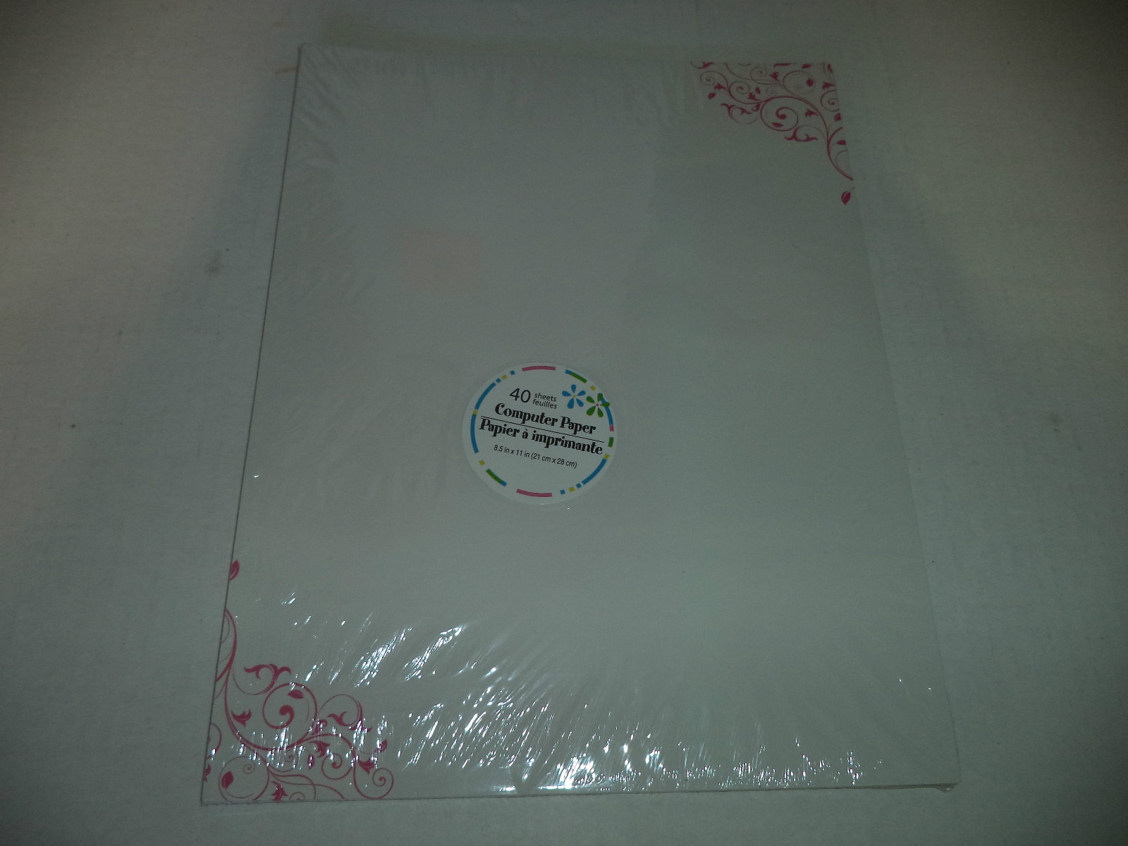 Forty Sheets Of White Computer Paper With Pink Swirls On Two Corner Edges